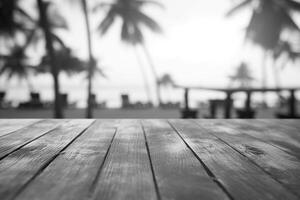 Wooden table with bokeh lights on background. Black and white photo