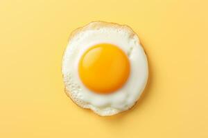 frito huevo en amarillo fondo, parte superior vista. sano desayuno concepto ai generado foto