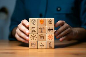 Close up Of Businesswoman's Hand Holding Wooden Cube With Construction Icons Ai Generated photo