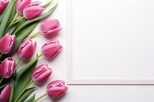 Pink tulips and blank photo frame on white wooden background. Top view with copy space Ai Generated