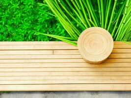 Wooden table on bamboo plant background ai generated photo