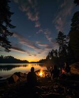 A family sitting around a campfire at dusk. Generative AI photo