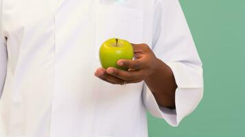 A doctor holding an apple. Generative AI photo