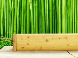 Wooden table on bamboo plant background ai generated photo