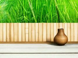 Wooden table on bamboo plant background ai generated photo