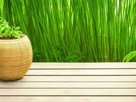 Wooden table on bamboo plant background ai generated photo