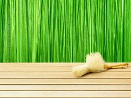 Wooden table on bamboo plant background ai generated photo