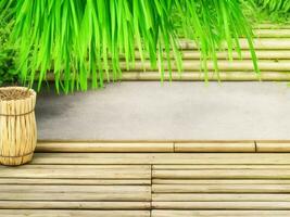 Wooden table on bamboo plant background ai generated photo