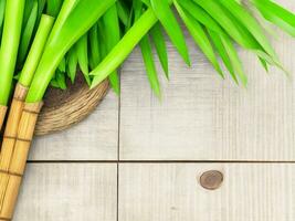 Wooden table on bamboo plant background ai generated photo