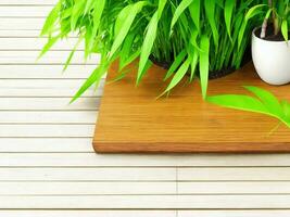 Wooden table on bamboo plant background ai generated photo