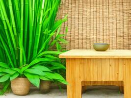 Wooden table on bamboo plant background ai generated photo