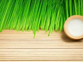 Wooden table on bamboo plant background ai generated photo