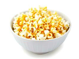 bowl with corn popcorn on white background photo