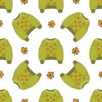 Seamless pattern with green sweater and maple leaves. Vector