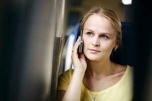 Woman listening to a call on her mobile photo