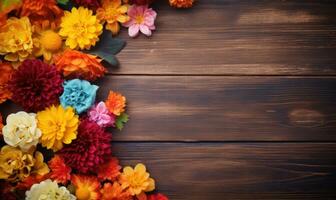 Ai generated Autumn flowers frame on wooden background. Seasonal yellow and red flowers. Autumn background. Space for text. photo