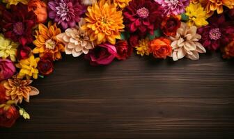 Ai generated Autumn flowers frame on wooden background. Seasonal yellow and red flowers. Autumn background. Space for text. photo