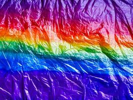 rainbow colored crumpled plastic texture for background. photo