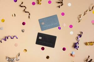 Credit cards and holiday tinsel top view, flat lay. Sale concept photo