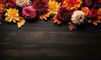 Ai generated Autumn flowers frame on wooden background. Seasonal yellow and red flowers. Autumn background. Space for text. photo