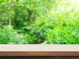 empty wooden tabletop podium in garden open forest, blurred green plants background with space. organic product presents natural placement pedestal display, spring and summer concept photo