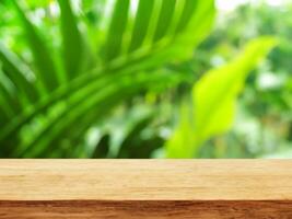 empty wooden tabletop podium in garden open forest, blurred green plants background with space. organic product presents natural placement pedestal display, spring and summer concept photo