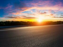 Empty asphalt road and beautiful sky at sunset, panoramic view. photo