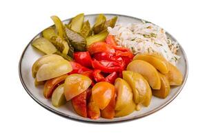 mixed pickles on a white plate photo