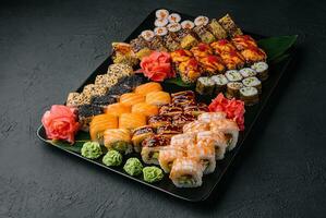 Sushi set on the black plate photo