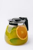 refreshing tea with lime and orange and mint photo