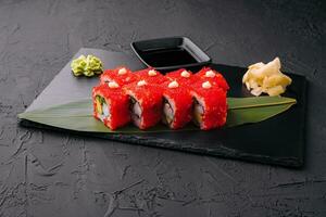 Sushi, rolls, California uramaki with tobiko caviar photo