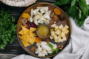 Different types of delicious cheese and snacks photo