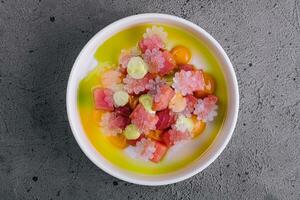 Tartar of tuna with lime snow on top view photo
