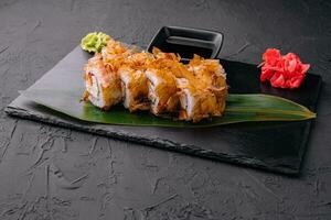 Sushi bonito roll on a dark background photo