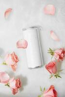 Wet metal aluminum beverage drink can with rose petals photo