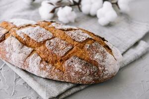 Bread rye, whole grain on a grey background photo
