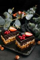 Delicious chocolate cake decorated with fresh berries photo