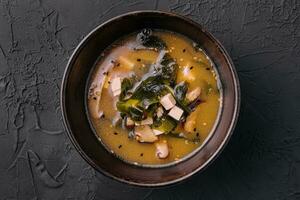 Soup with algae and mushrooms top view photo