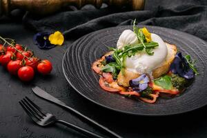 Buffalo burrata cheese served with grain toast pasting and fresh vegetables photo