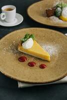 Cheesecake on a plate and a cup in coffee photo