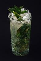 Mojito cocktail with fresh mint on dark background photo