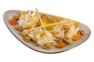 cheese plate with walnuts and honey photo