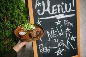 Signboard on the street. Grilled beef fillet steak photo