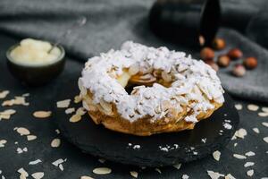 French traditional cake powdered sugar and almond petals photo