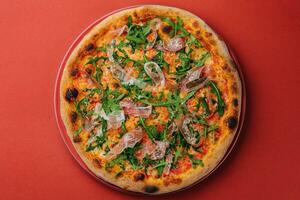 Prosciutto pizza or pinza with arugula in roman style photo