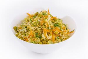 Fresh vegetables salad with cabbage carrot and green peas photo