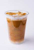 Cold coffee with milk, caramel and ice photo