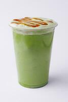 Plastic cup of fresh matcha latte photo