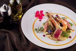 Tuna fish tataki with shrimp and couscous photo