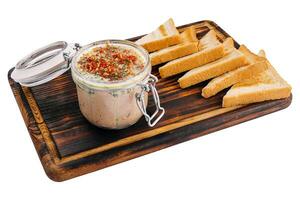 Delicious liver pate on wooden board photo